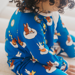 Baby wearing the ZIPSTER x Miffy Starry Sleep bamboo babygrow